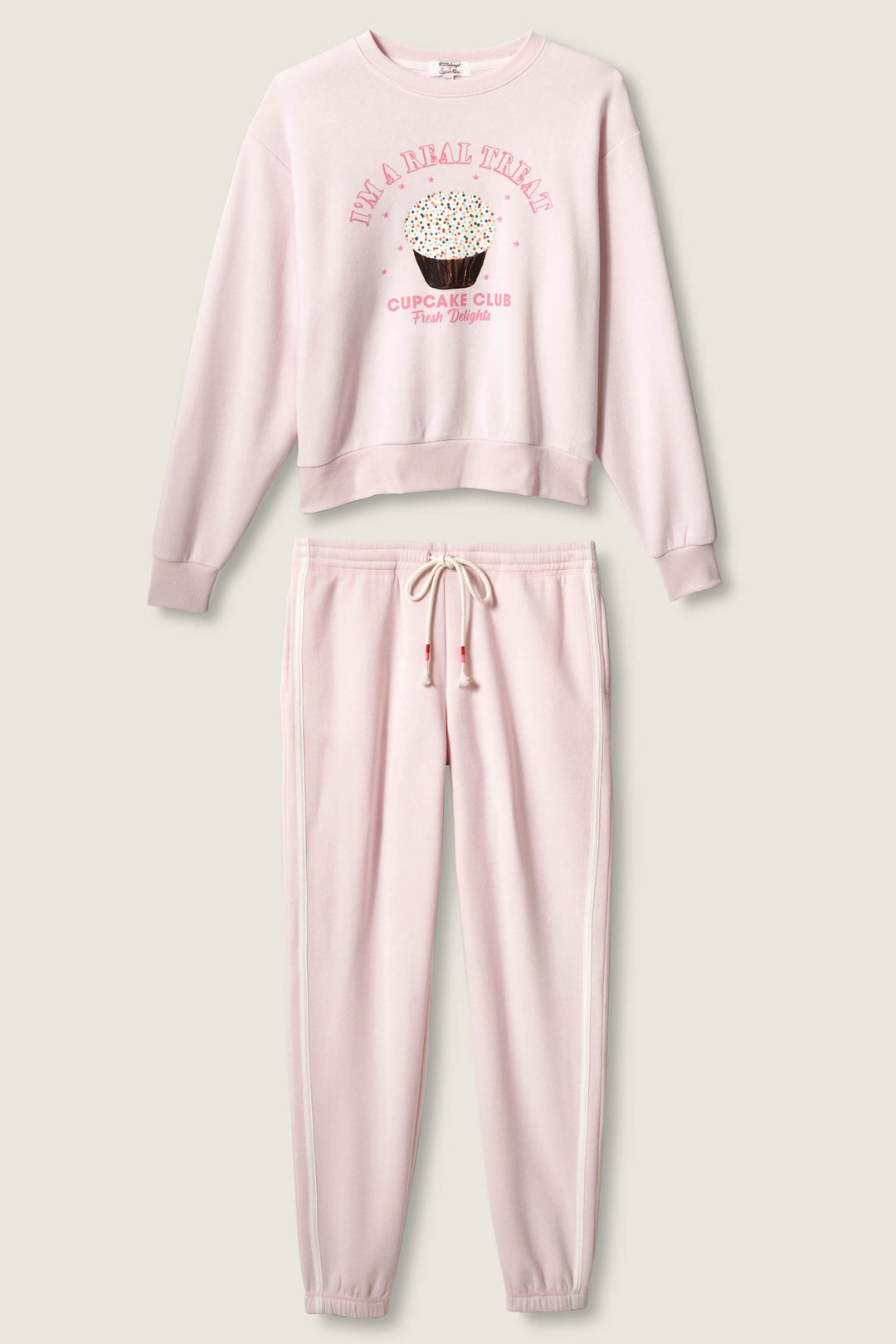 The Sweet Life "I'm A Real Treat" Lounge Set by P.J. Salvage features a light pink sweatshirt with a cupcake illustration and playful text, plus matching drawstring sweatpants for cozy style.