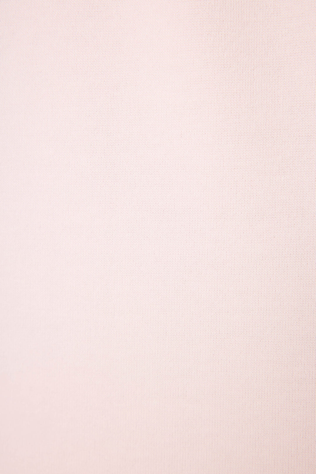 Close-up of the Sweet Life "I'm A Real Treat" Lounge Set by P.J. Salvage, featuring soft light pink fabric with a fine, subtle texture and no visible patterns or designs.