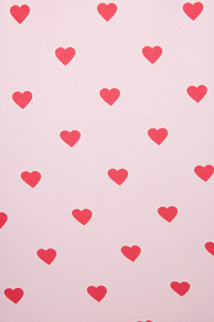 The Wildest Dreams Heart Print Nightshirt by P.J. Salvage features a light pink background with an allover pattern of small red hearts.
