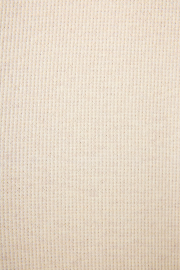Close-up of the Cross Stitch Casuals Light Beige Lounge Set by P.J. Salvage, showcasing its beige ribbed fabric with vertical lines and a subtle textured finish for a uniform look.