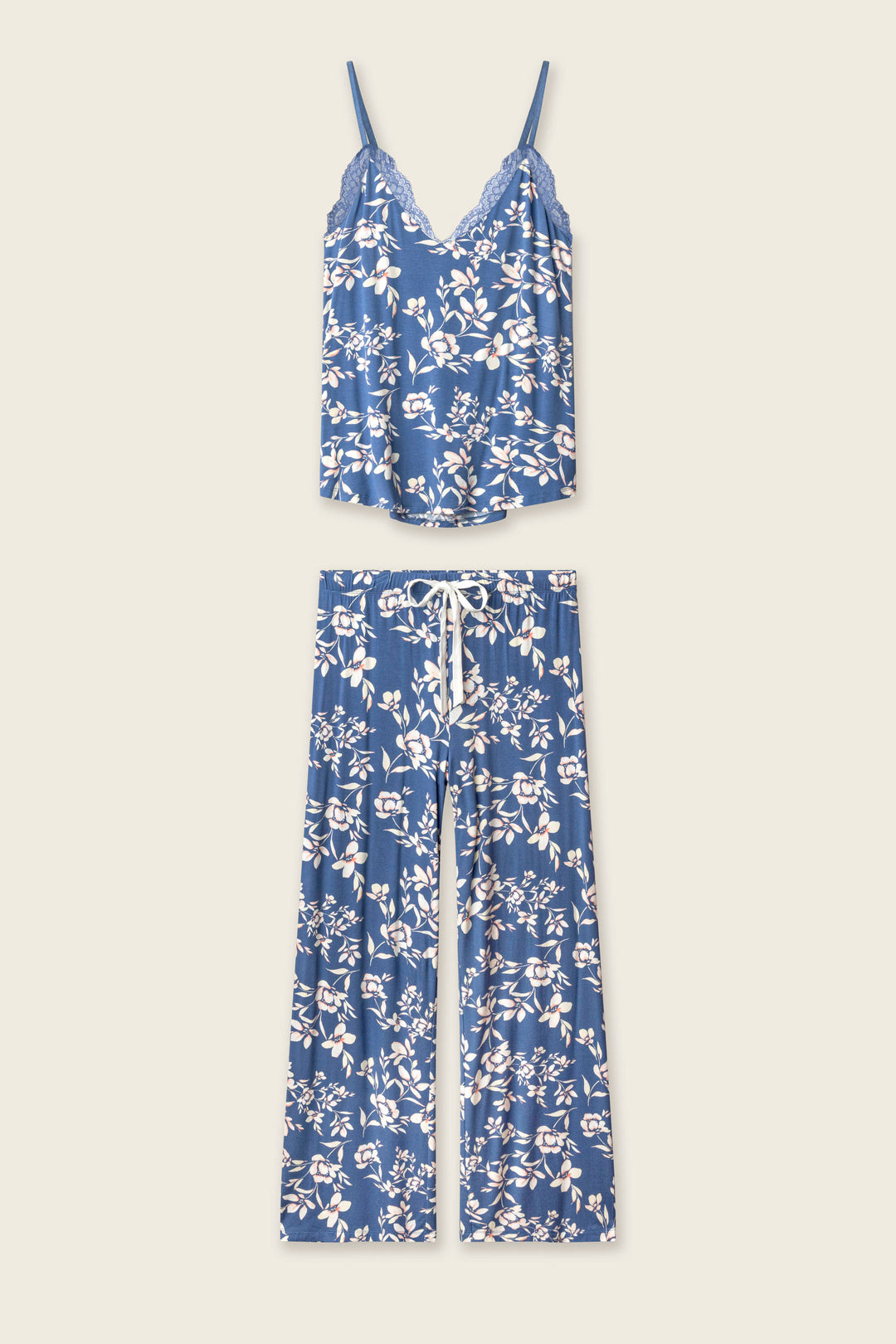 The Flora Dreams Twilight Garden Long PJ Set by P.J. Salvage is crafted from silky modal jersey in a blue floral print, featuring a lace-trim cami top and matching drawstring wide-leg pants, both displayed flat on a light background.