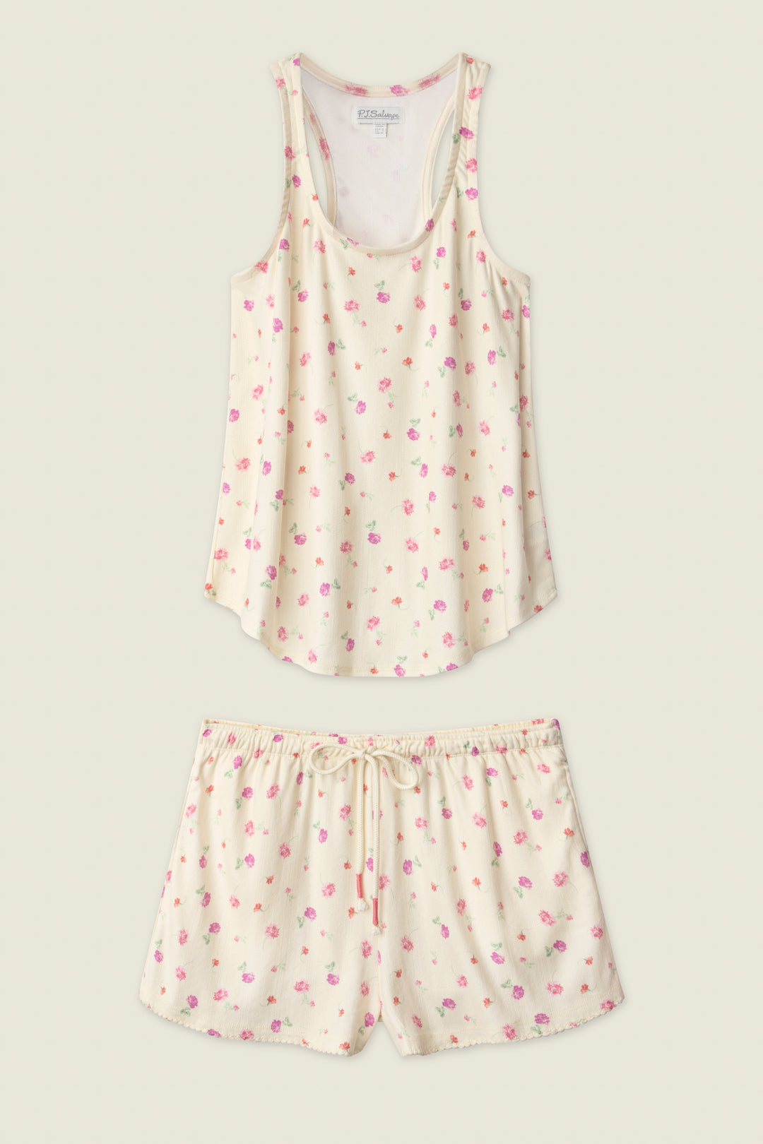The P.J. Salvage For the Mamas Butter Blooms Short PJ Set features a cream sleeveless tank and drawstring shorts, both adorned with a delicate pink and purple floral print for a charming bedtime look.