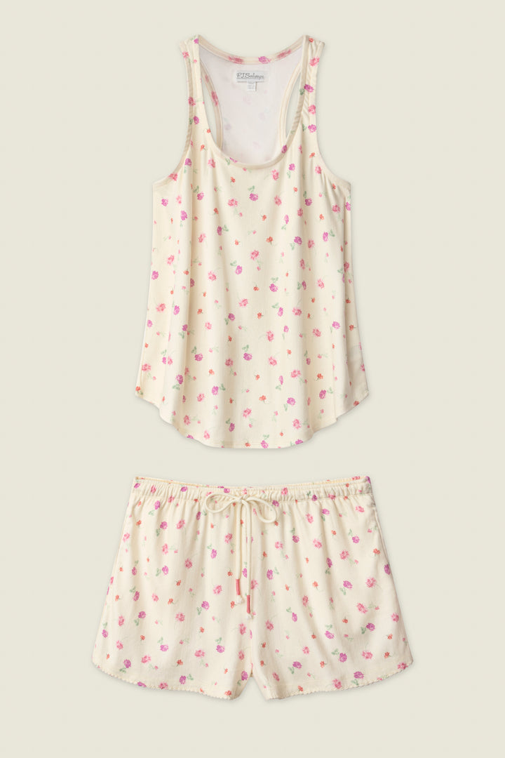 The P.J. Salvage For the Mamas Butter Blooms Short PJ Set features a cream sleeveless tank and drawstring shorts, both adorned with a delicate pink and purple floral print for a charming bedtime look.
