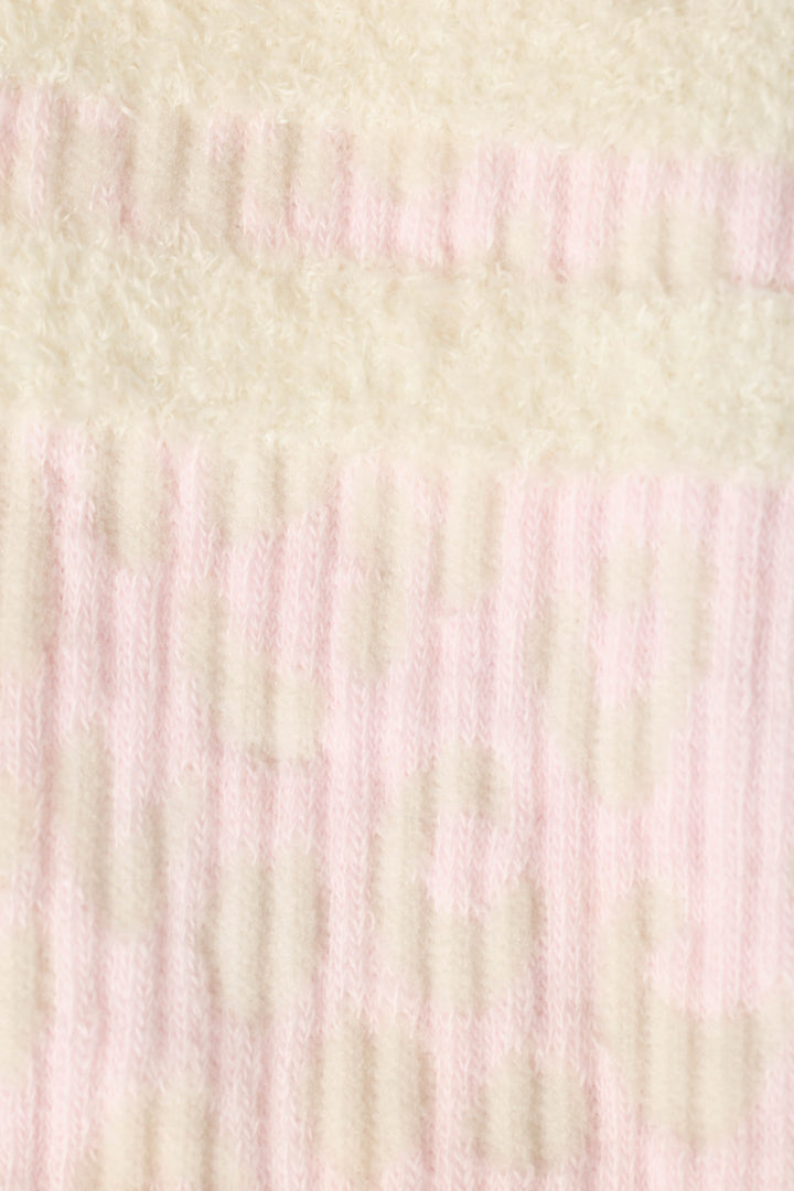 A close-up of Luxe Leopard Dreams Ribbed Crew Socks by P.J. Salvage, featuring soft ribbed fabric with pale pink and off-white stripes and subtle circular patterns.