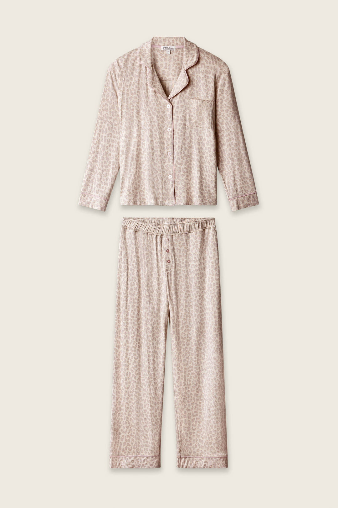 The P.J. Salvage Luxe Leopard Dreams PJ Set features a soft jersey long-sleeve button-up top and wide-leg pants in light beige with a subtle leopard print, shown on a plain light background.