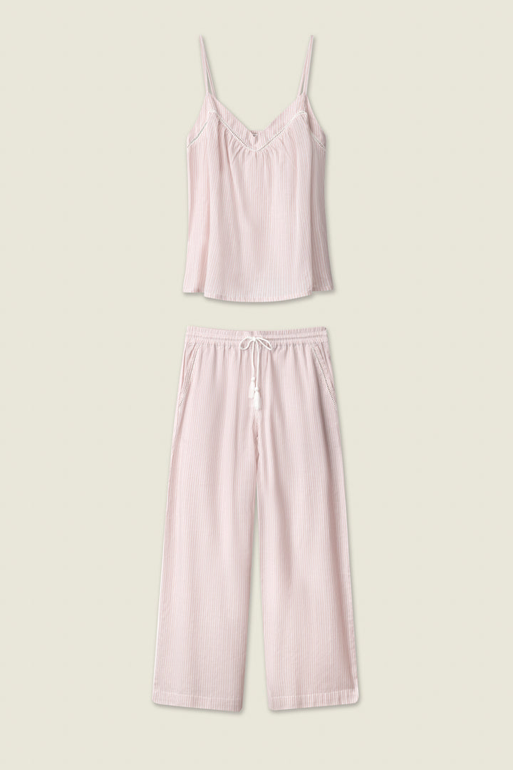 The On Cloud Nine Silver Rose Long PJ Set by P.J. Salvage is a two-piece cotton pajama in light pink, with a sleeveless V-neck camisole and matching drawstring wide-leg pants, shown against a plain beige background.
