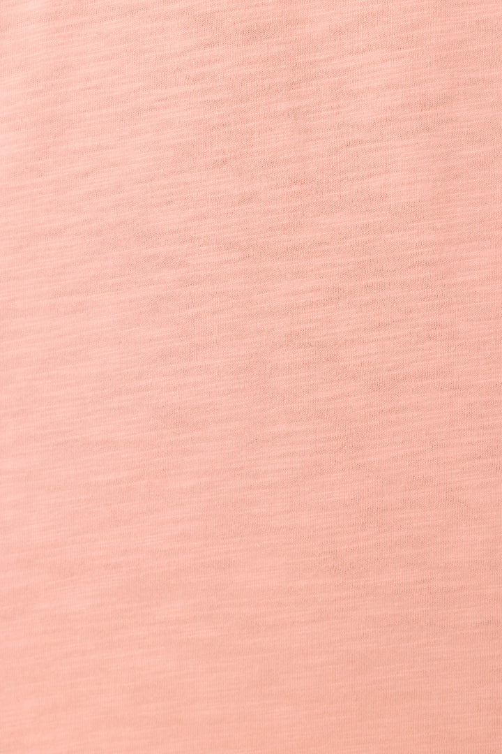 Close-up of the Paloma Mama Tequila Por Favor Graphic T-Shirt by P.J. Salvage—a soft grapefruit pink crew tee in cotton-modal slub jersey, featuring a subtle horizontal texture and gentle heathered shading.