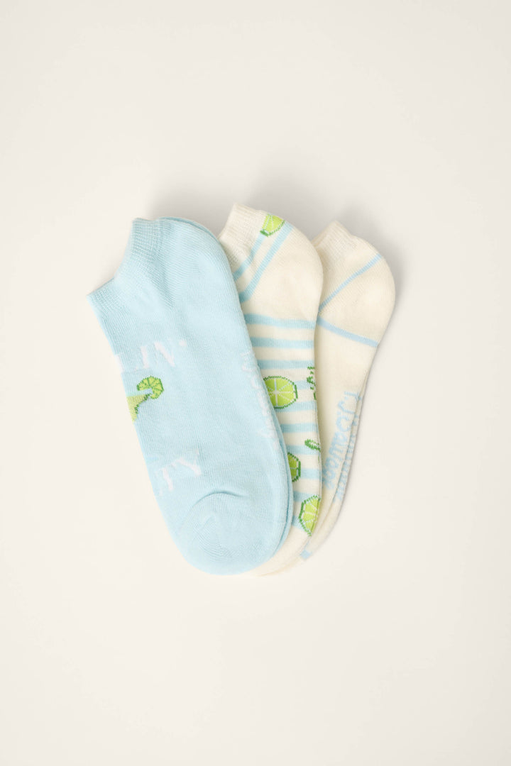 Three pairs of Playful Prints Feeling Salty 3-Pack No Show Socks by P.J. Salvage, in light blue and off-white with lime and blue stripe patterns, are displayed on a white surface.