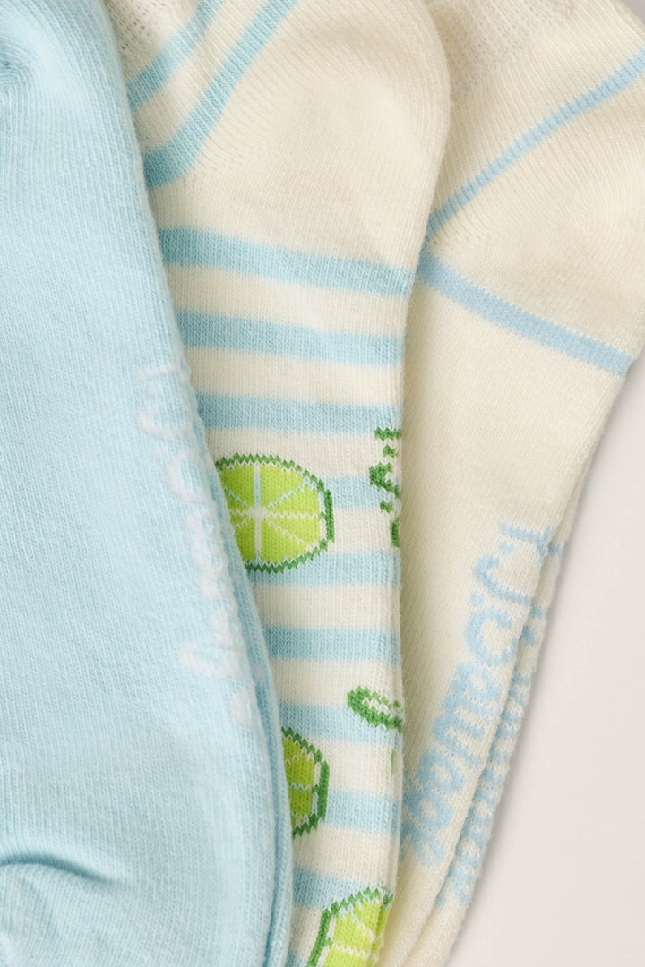 The P.J. Salvage Playful Prints Feeling Salty 3-Pack No Show Socks features coastal-inspired designs in light blue, white with blue stripes and lime patterns, and white with blue stripes—combining comfort and style for every step.