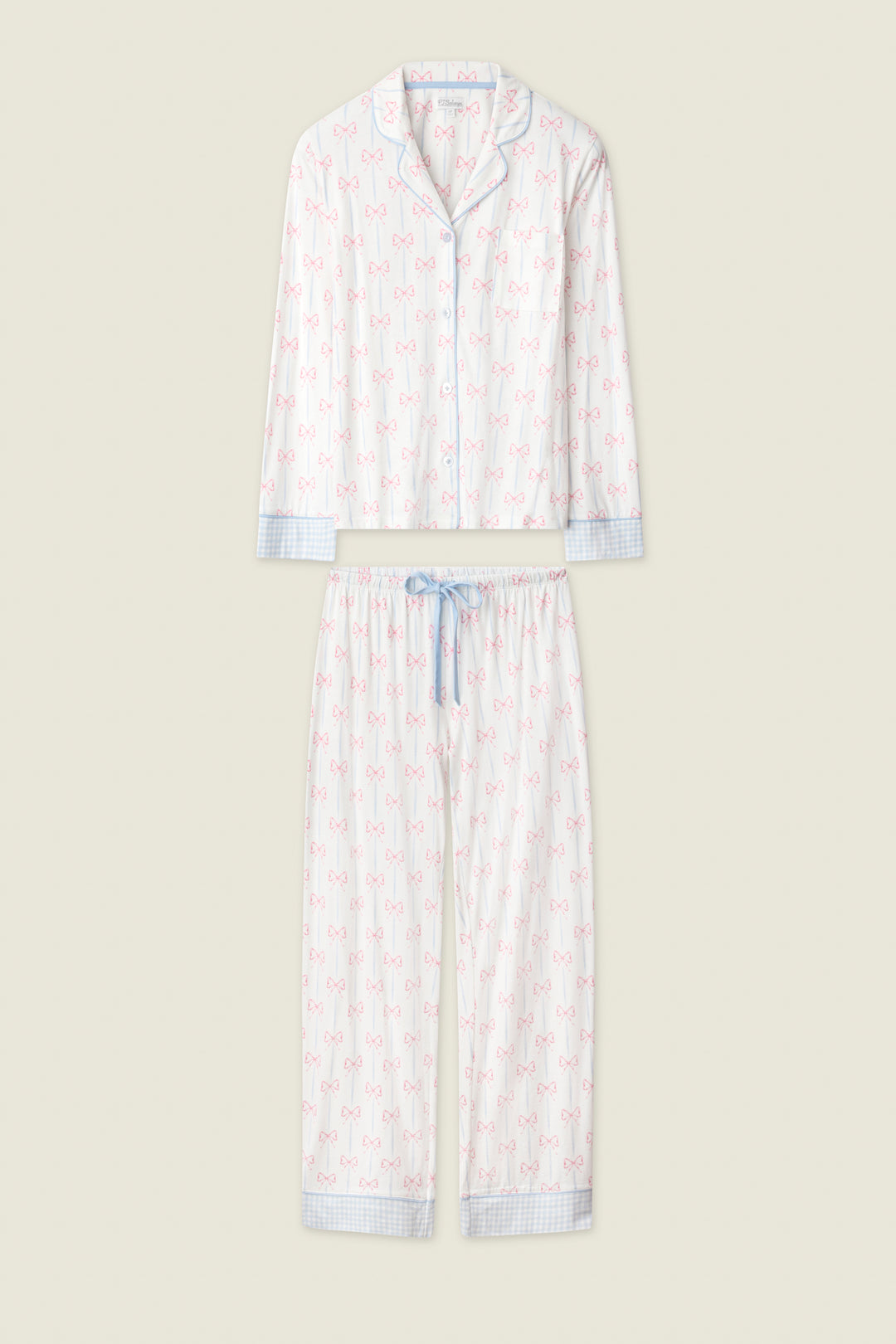 The Playful Prints All Wrapped Up Long PJ Set by P.J. Salvage features a white button-front shirt and matching pants with pink bow prints, blue plaid trim, and a coordinating blue drawstring waist.