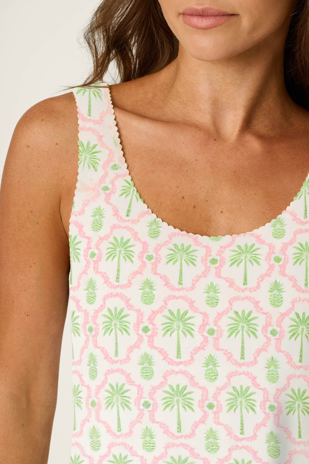 White cotton-modal jersey featuring a playful pattern of green palm trees, pineapples, and pink accents.