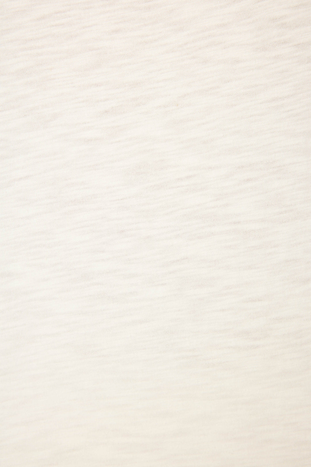 A close-up of the Playful Prints Bon Voyage Graphic Tee by P.J. Salvage shows its light beige cotton-modal jersey with a subtle wavy texture—smooth, uniform, and perfect for a relaxed, minimal look ideal for coastal escapes.