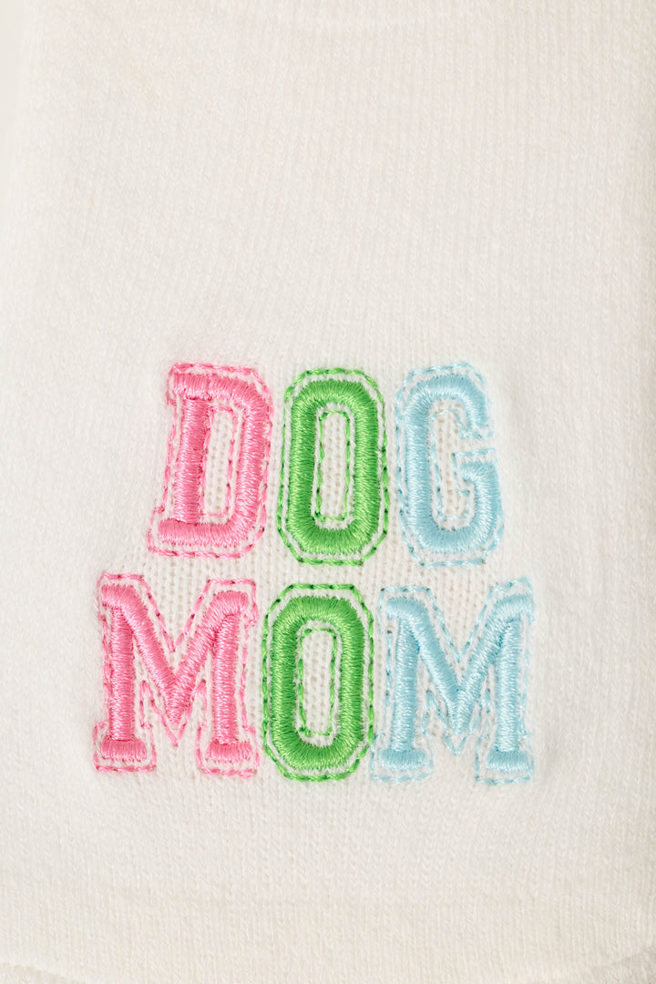 P.J. Salvage’s Pupcation Palms Dog Mom 2-Pack Cushion Liner Socks feature white fabric with “DOG MOM” embroidered in colorful block letters and cushioned soles for comfort and style.