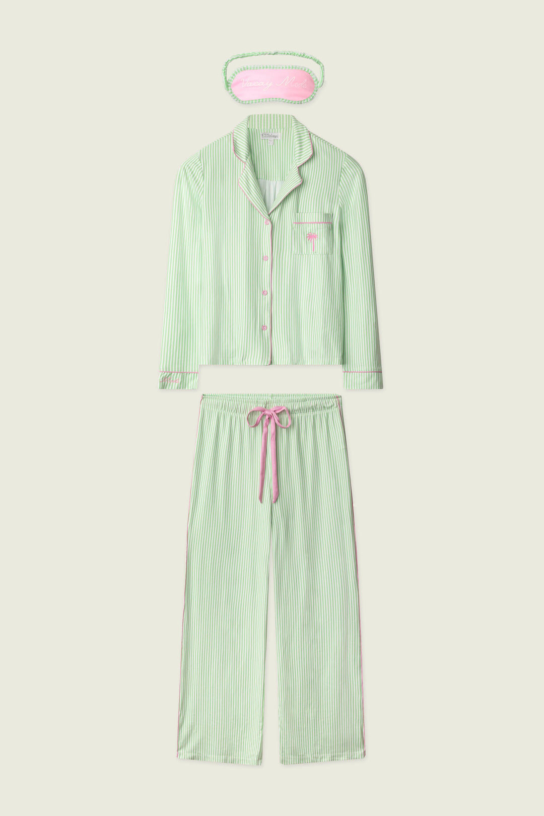 The P.J. Salvage Pupcation Palms Kiwi Stripe 3-Piece PJ Set features a light green and white striped long-sleeve button-up top, drawstring pants, and an eye mask with pink accents for a cozy, coordinated look.
