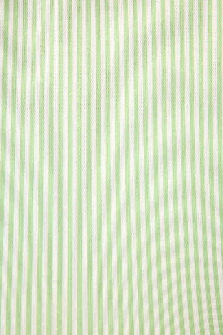 A close-up of the Pupcation Palms Kiwi Stripe 3-Piece PJ Set by P.J. Salvage, featuring evenly spaced vertical light green and white stripes—perfect for a stylish women's sleepwear look.