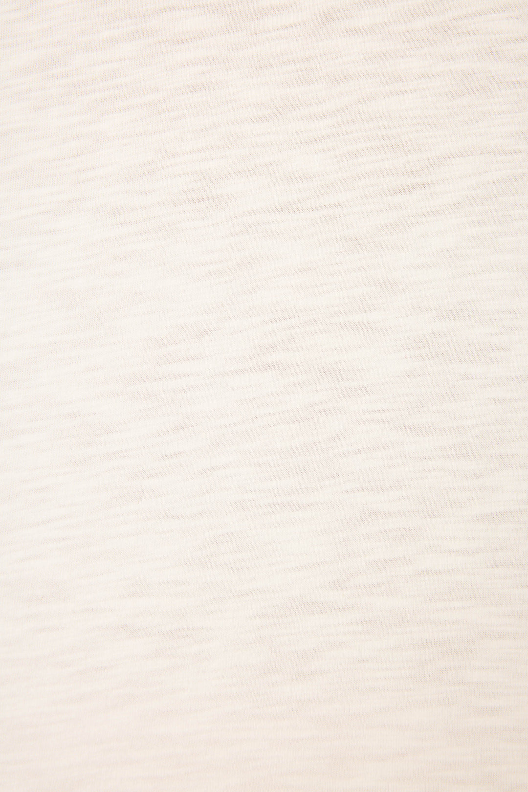 A close-up of the P.J. Salvage Pupcation Palms Dog Mom Graphic Tee reveals its relaxed crewneck design in light beige cotton-modal, featuring subtle horizontal texture and faint lines for a slightly heathered look.