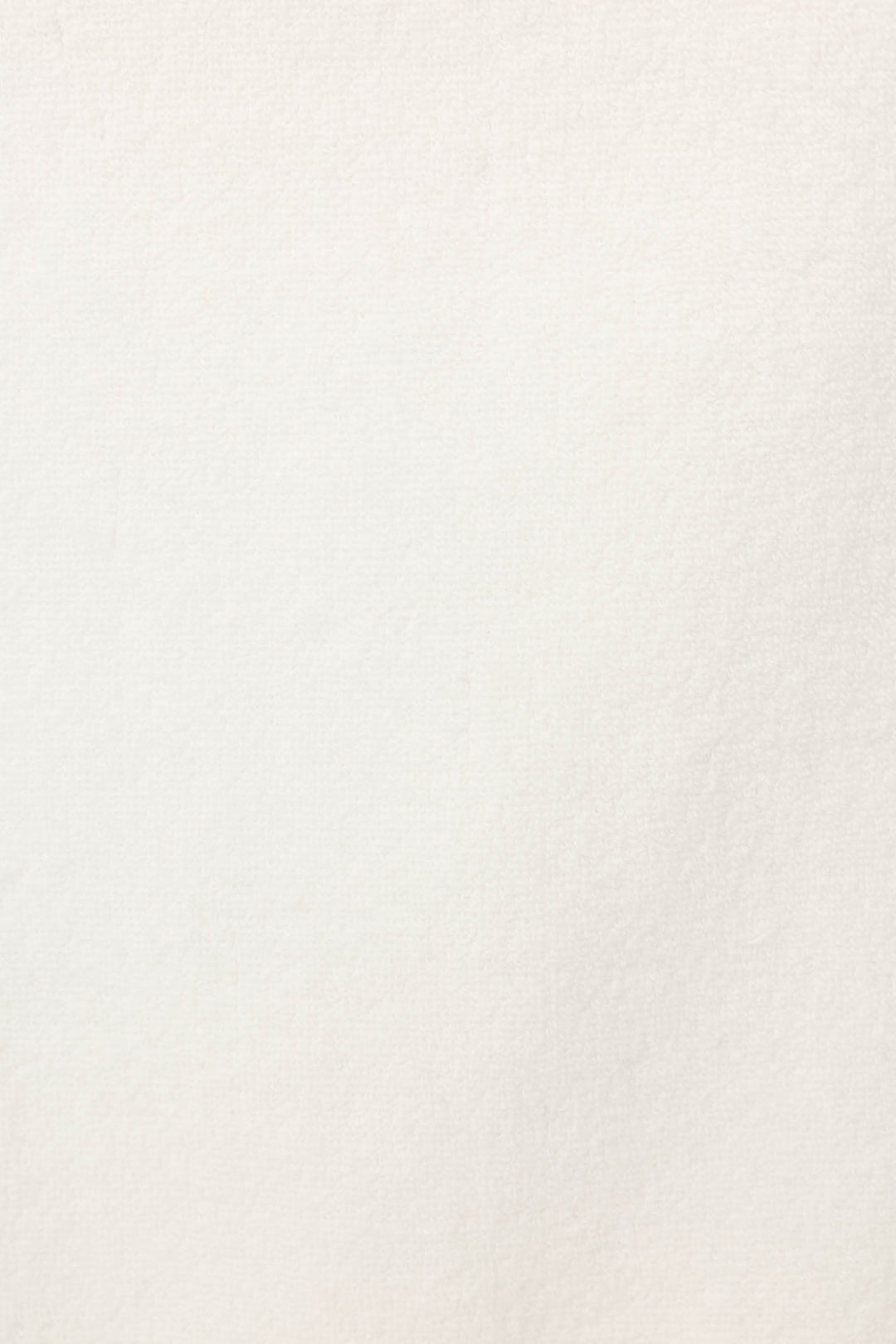 A close-up of the Playful Terry Happy Hour Robe by P.J. Salvage shows its off-white, textured terry fabric with subtle shading and fine grain.