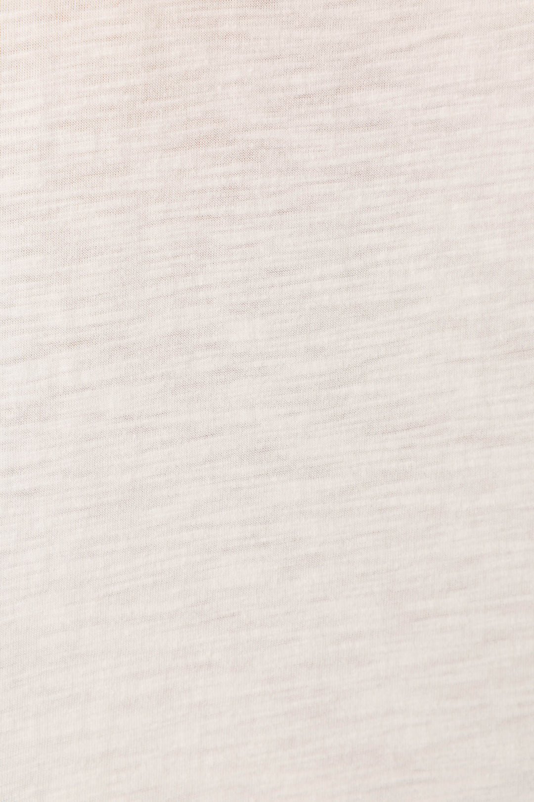 Close-up of the Washed Away Weekend I Love You Graphic Tee by P.J. Salvage, featuring light beige slub-jersey fabric with a soft, subtle horizontal texture and faint lines, giving a smooth woven look without visible patterns.