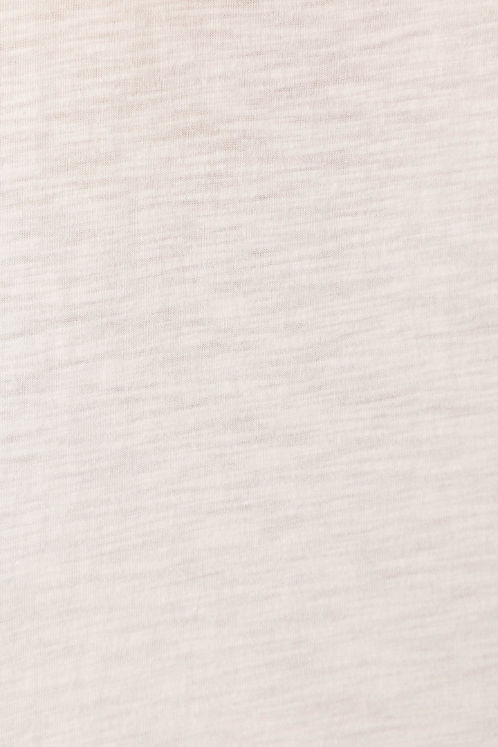 Close-up of the Washed Away Weekend I Love You Graphic Tee by P.J. Salvage, featuring light beige slub-jersey fabric with a soft, subtle horizontal texture and faint lines, giving a smooth woven look without visible patterns.