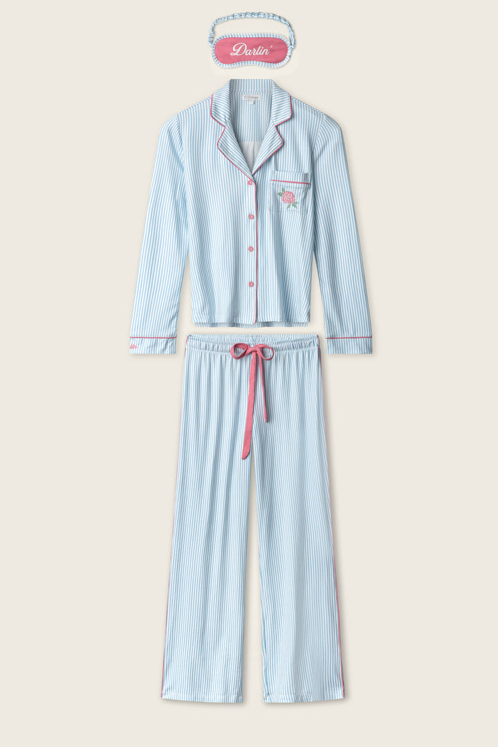 The P.J. Salvage Western Blooms Blue Stripe Darlin 3-Piece PJ Set features blue and white stripes, pink trim and waistband, and includes a long-sleeve button-up top, long pants, and a matching "Darlin" eye mask.