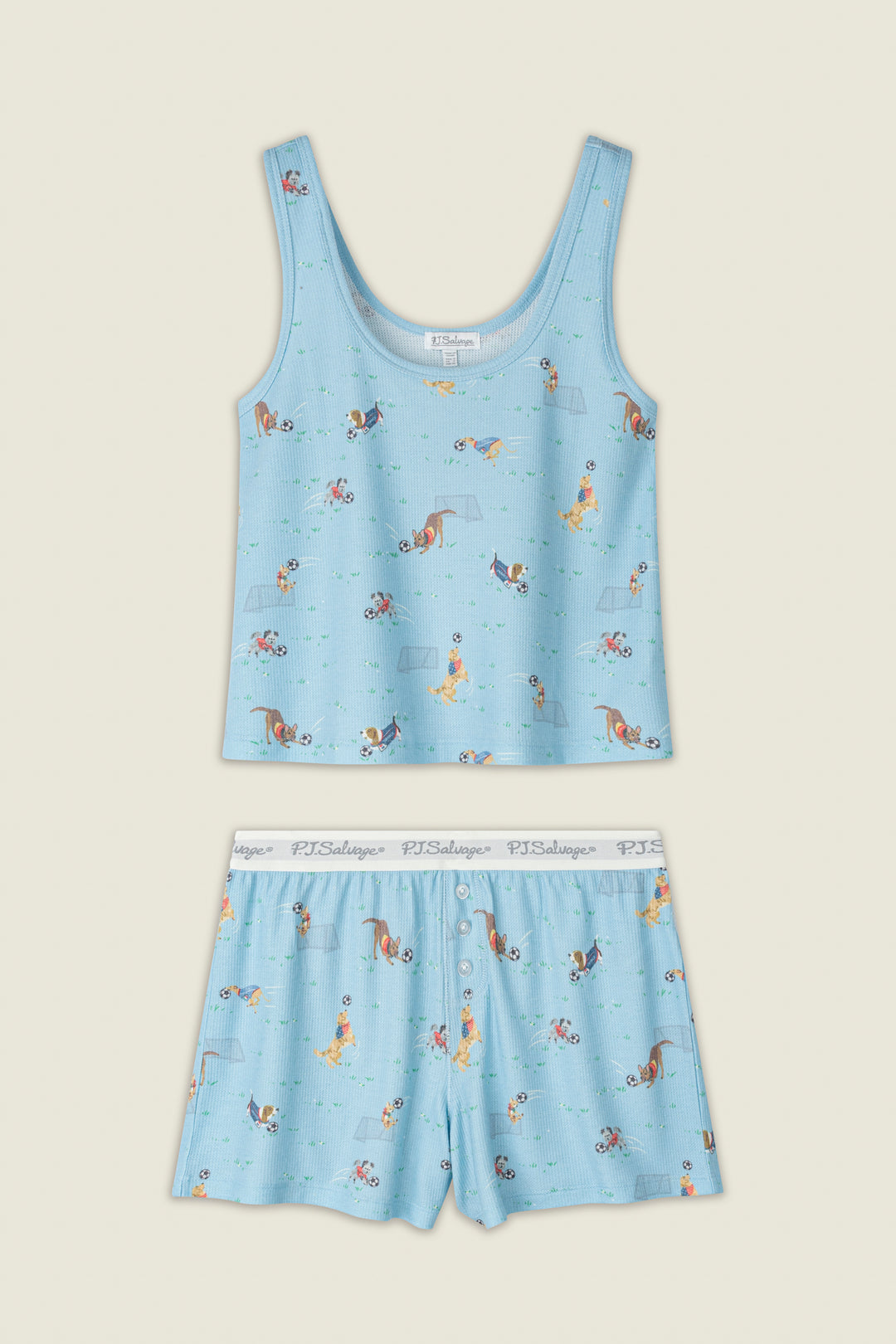 Light blue fabric with playful dogs and bones print, white elastic waistband featuring the PJ Salvage logo.