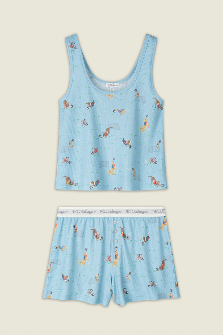 Light blue fabric with playful dogs and bones print, white elastic waistband featuring the PJ Salvage logo.
