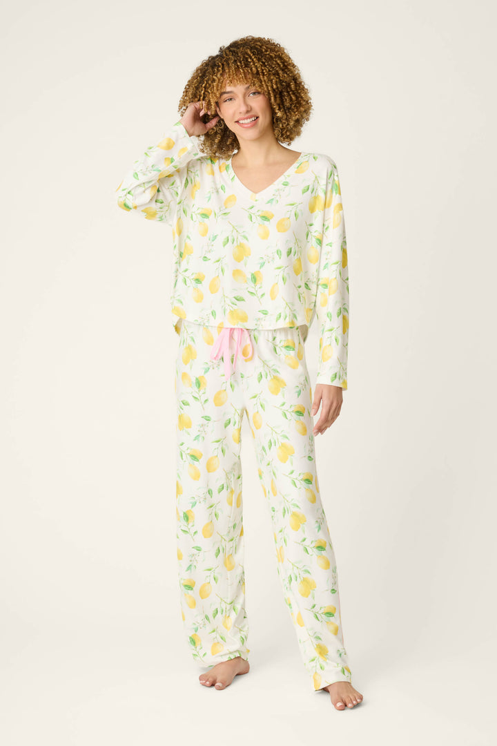Fabric features a vibrant lemon print on a light background with accents of pink, including a textured pink drawstring detail.