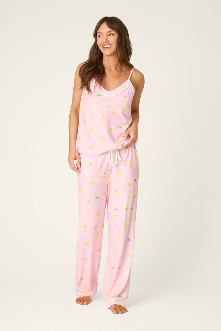 Light pink fabric with a repeating yellow lemon pattern, appearing soft and smooth in texture.