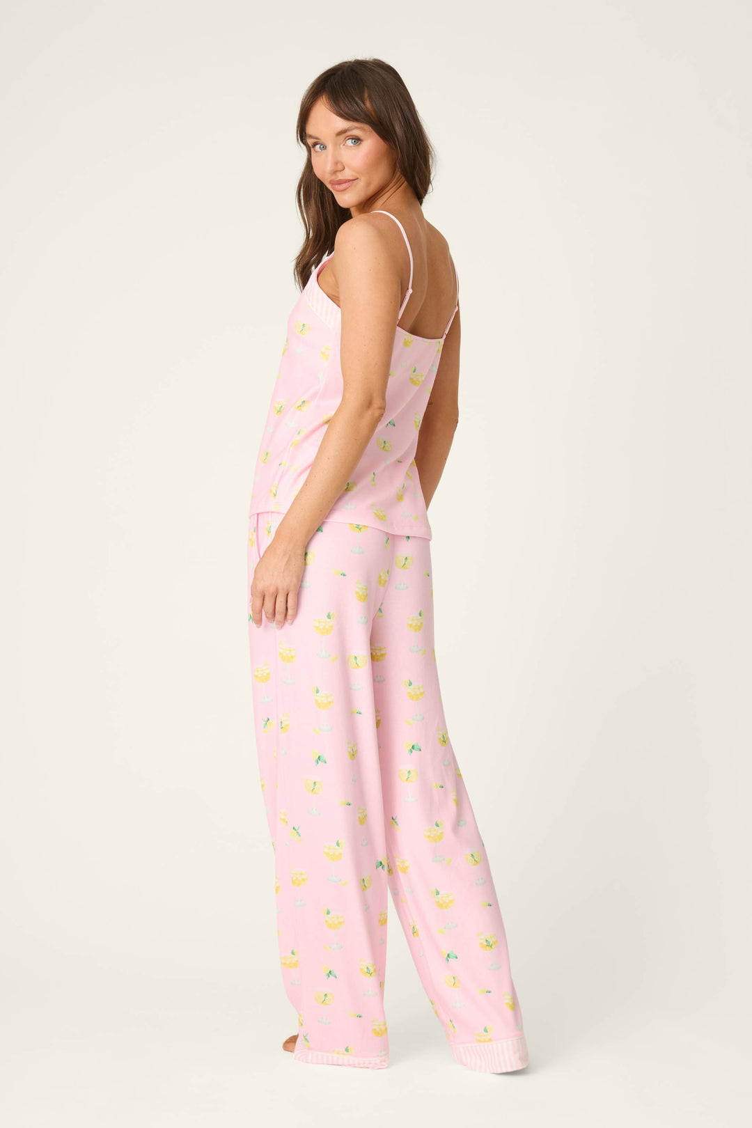 Pink fabric decorated with floral patterns; the material has a soft, lightweight appearance and a smooth, flowing texture.
