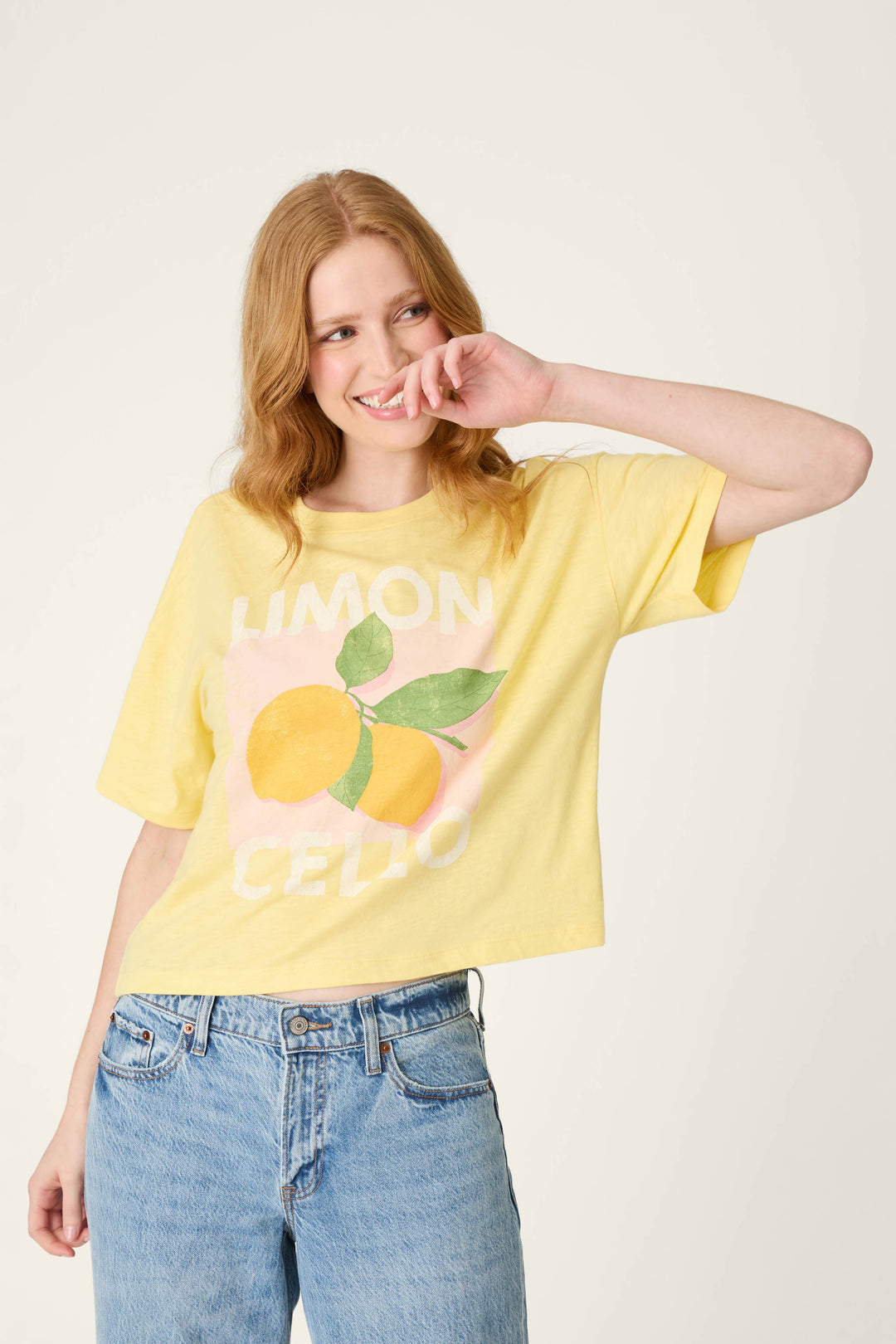 Yellow fabric featuring a print of lemons and the word "LIMONCELLO" in bold text.