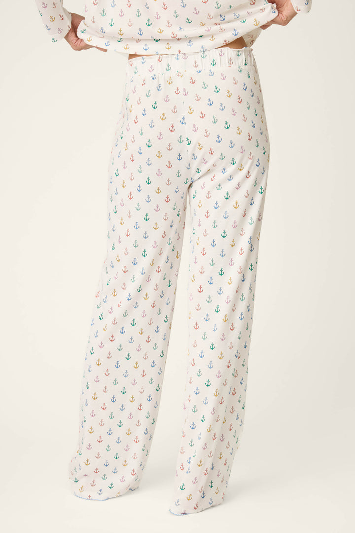 Fabric features a vibrant, multicolored anchor print on a soft, loose-textured material against a plain background.