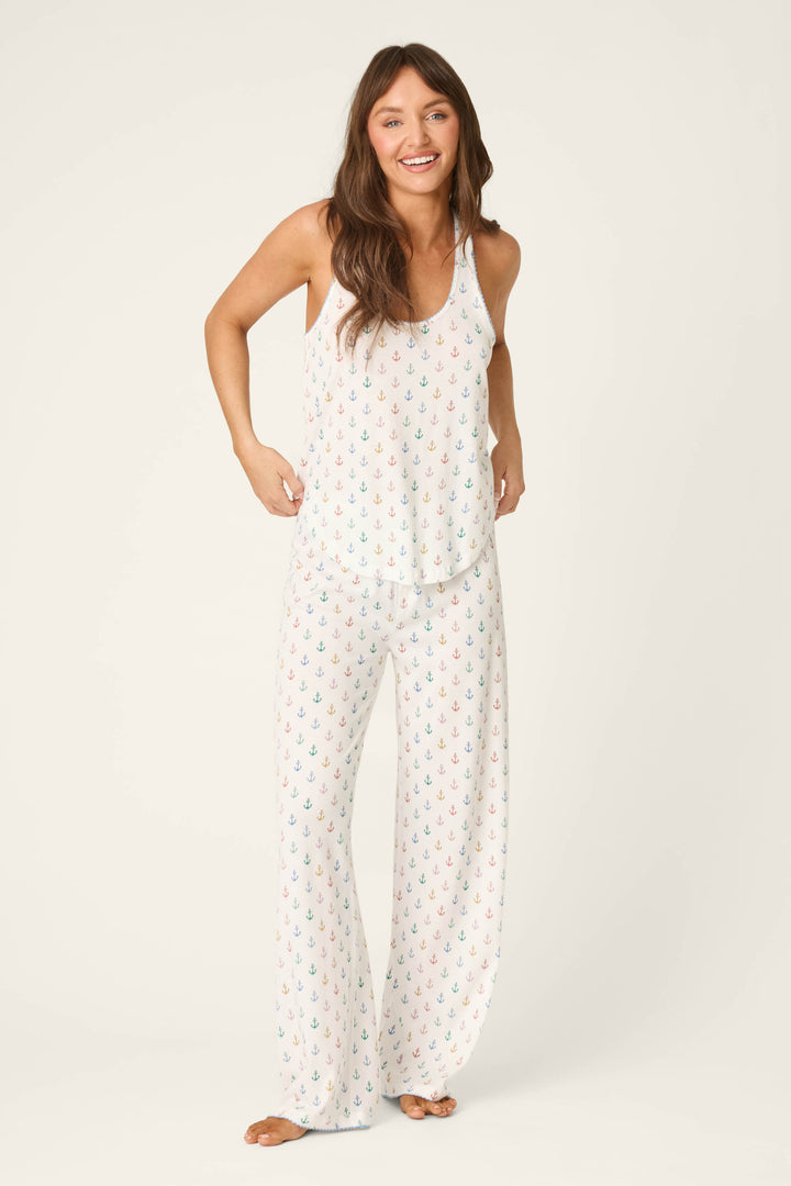 White fabric with a colorful, repeating anchor pattern; the texture appears soft and smooth.