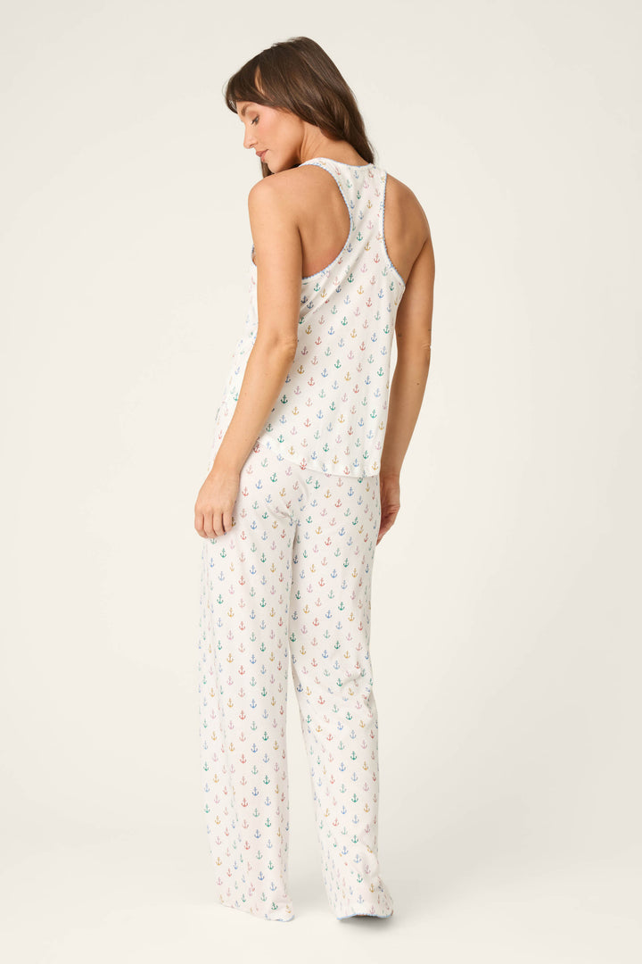 White fabric with a multicolored anchor print; smooth texture and vibrant pattern set against a plain light background.