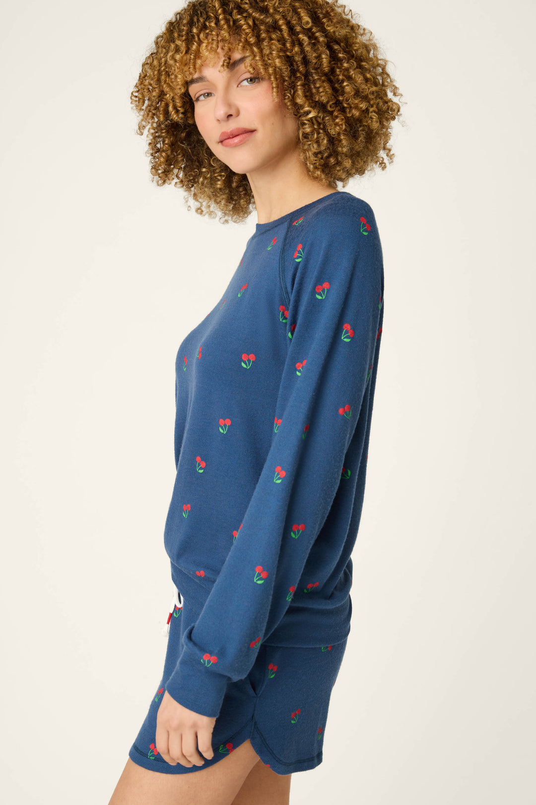True navy fabric featuring a star-spangled pattern with cherry prints.