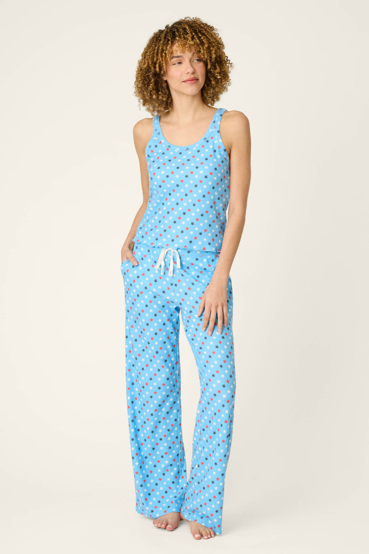 Fabric features a blue background with a scattered white star print; texture appears soft and lightweight.