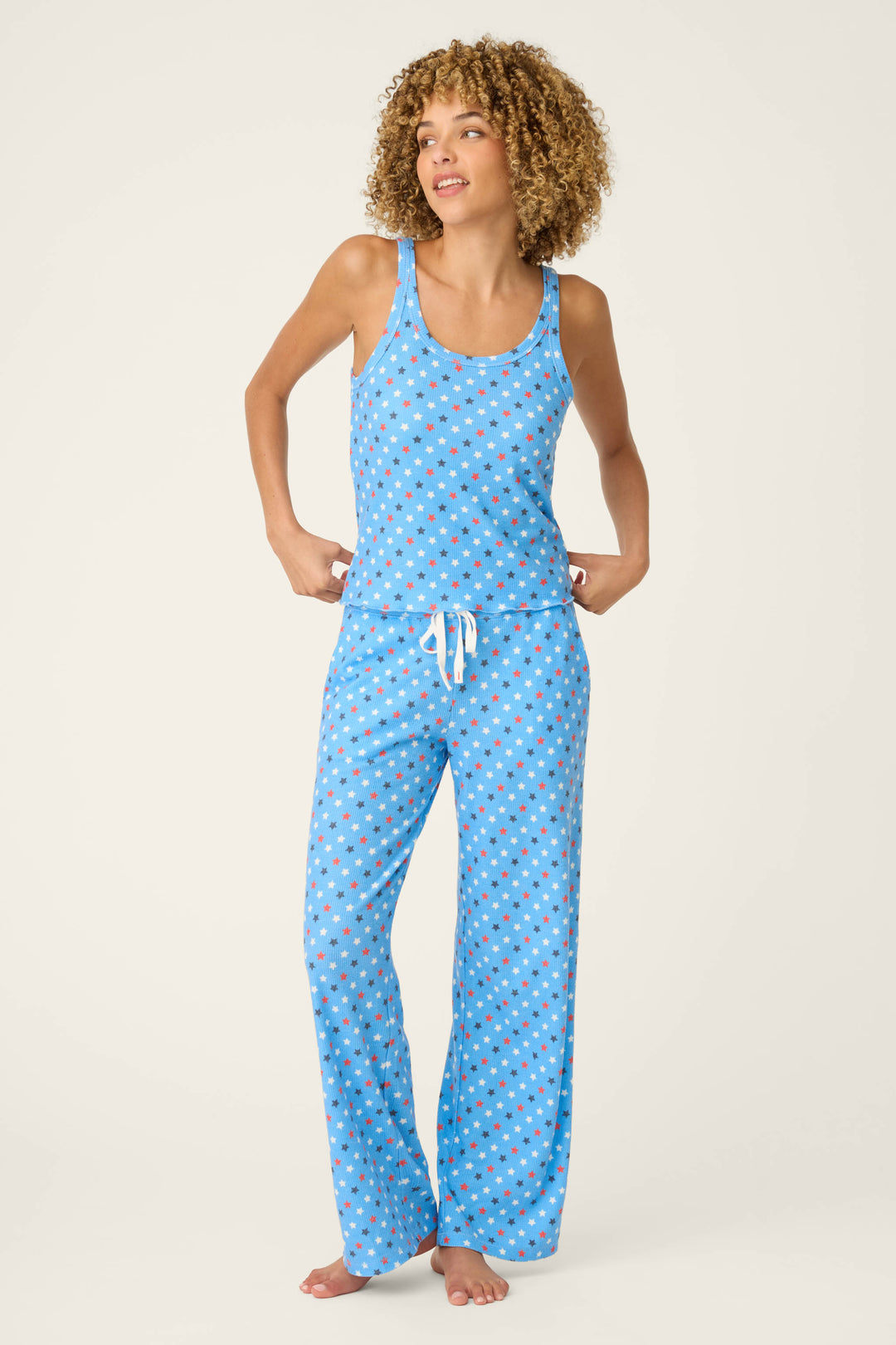 Bay blue fabric with a star print pattern; the material is soft with a summery vibe.