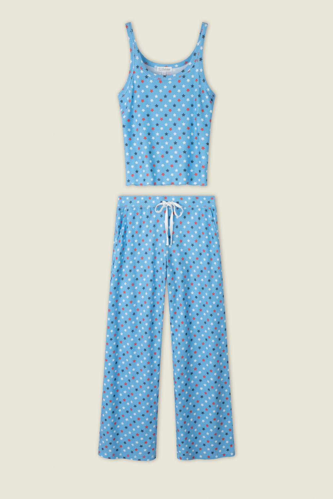 Blue fabric with small red, white, and blue star prints; includes a touch of white detail against the starry pattern.