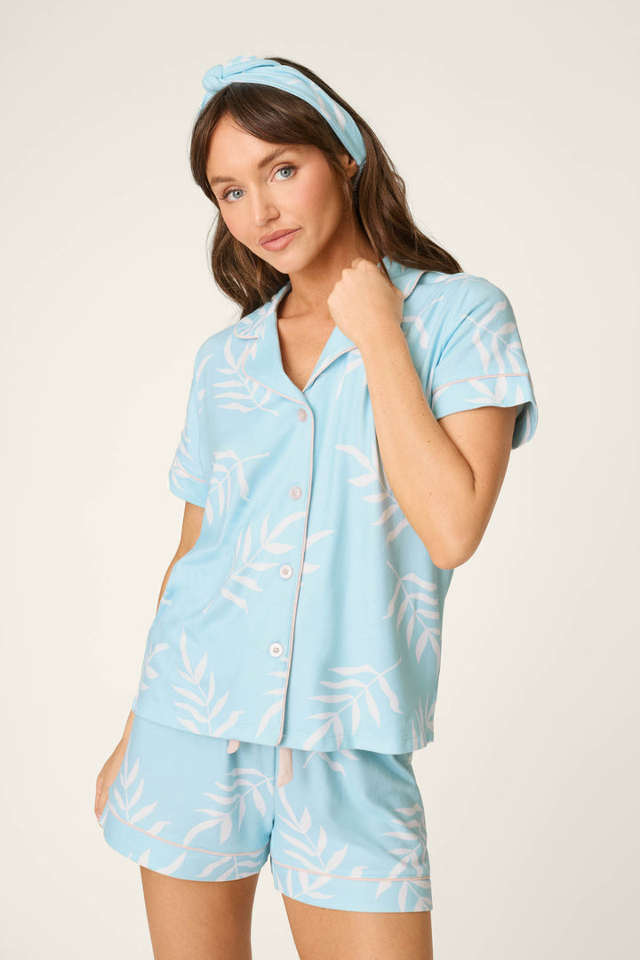 Light blue fabric with a leaf pattern; smooth texture, accented by a blue headband.