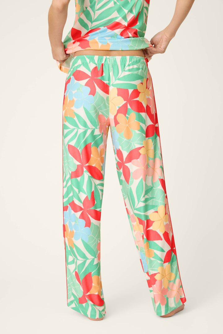 Vibrant tropical floral print with rich colors on buttery-soft jersey fabric, featuring a smooth, cozy texture.