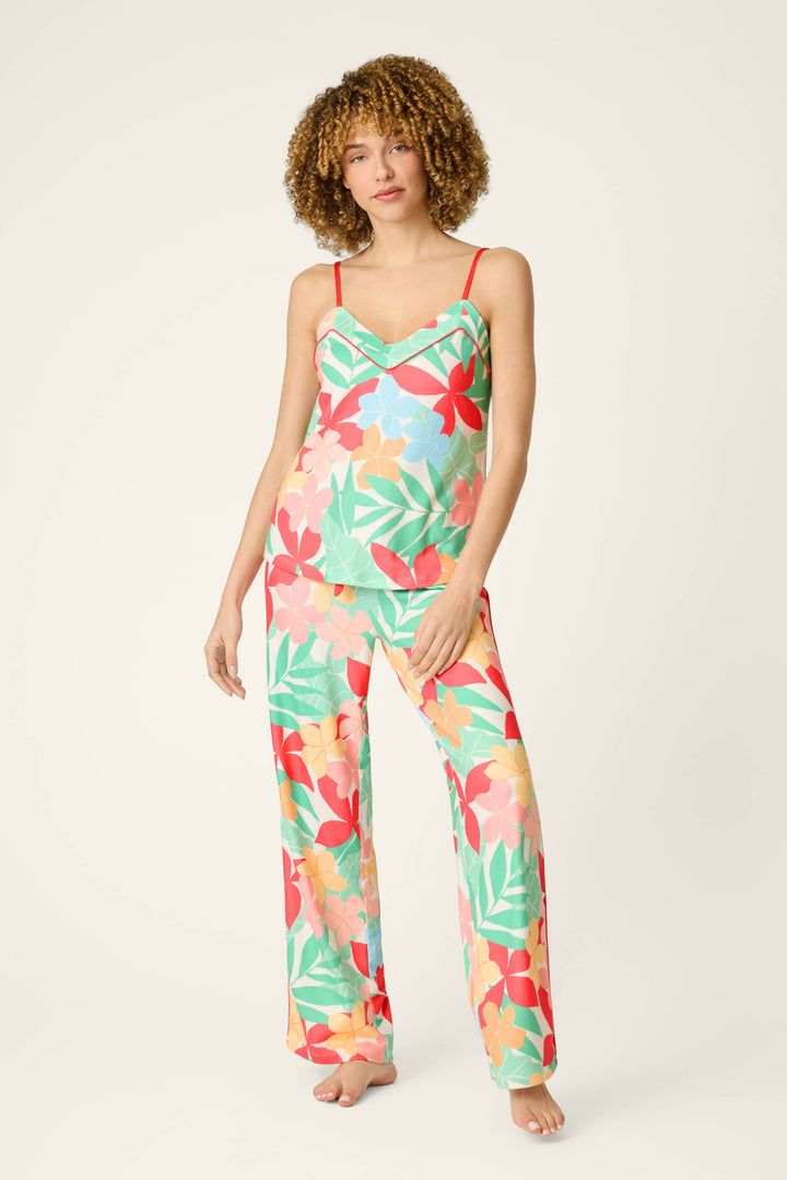 A vibrant tropical floral pattern in bold, bright colors on soft, lightweight fabric set against a plain light background.