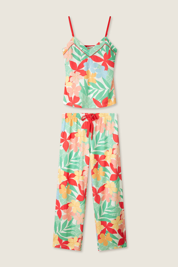 Vibrant red, yellow, and green floral print on a light background with a smooth texture, evoking a tropical feel.
