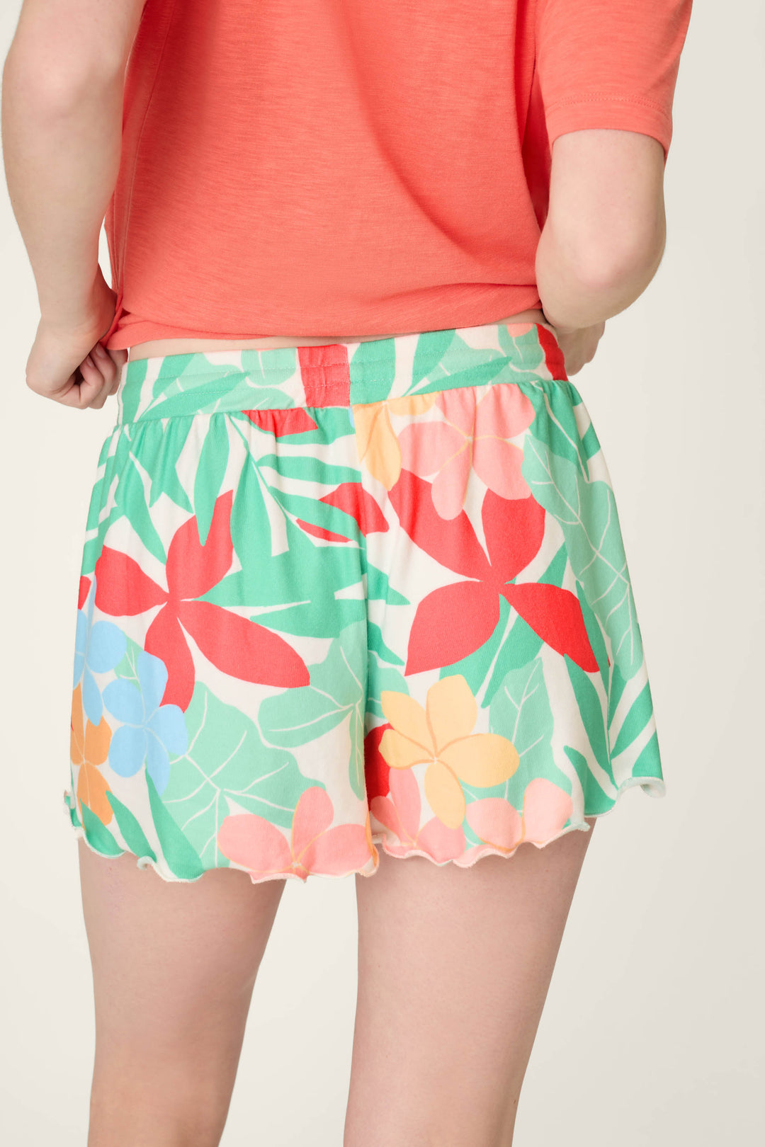A vibrant floral pattern in buttery-soft jersey with cheerful pops of red, yellow, blue, and green.