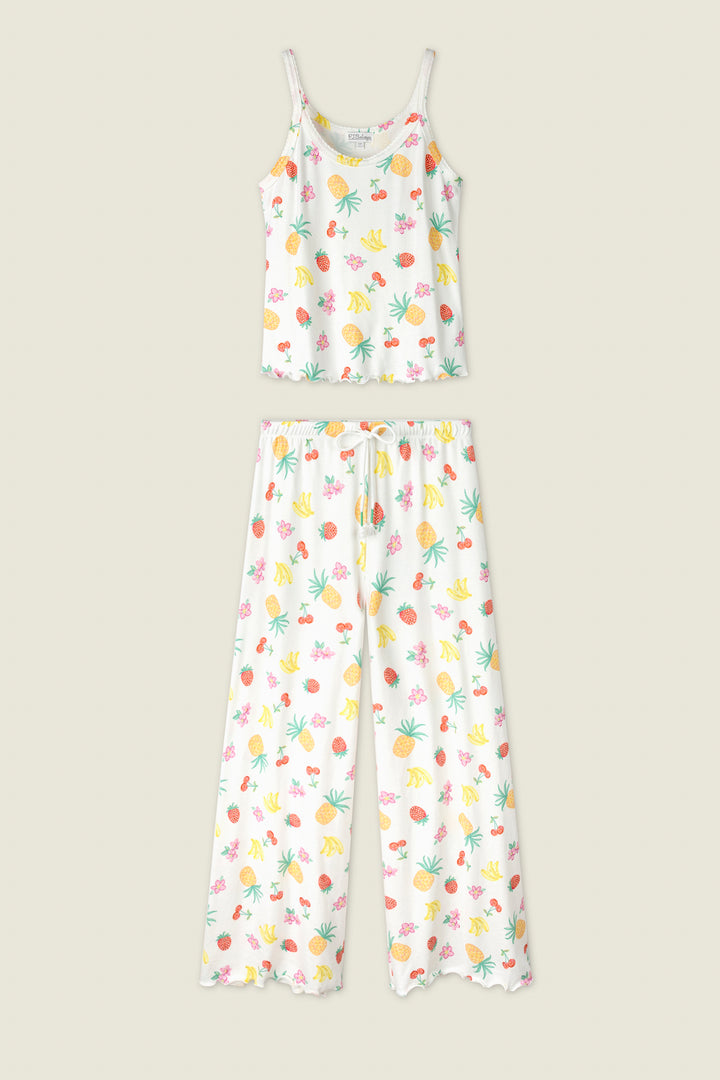 White fabric with a vibrant print of yellow bananas, green leaves, and pink flowers.