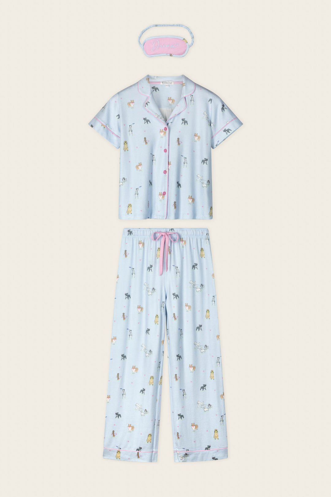 The Bark Park Fetch & Frolic 3-Piece PJ Set by P.J. Salvage features a light blue short-sleeve top, long pants, "Dream" sleep mask, cute animal prints, and pink accents—perfect women's sleepwear for dog lovers.