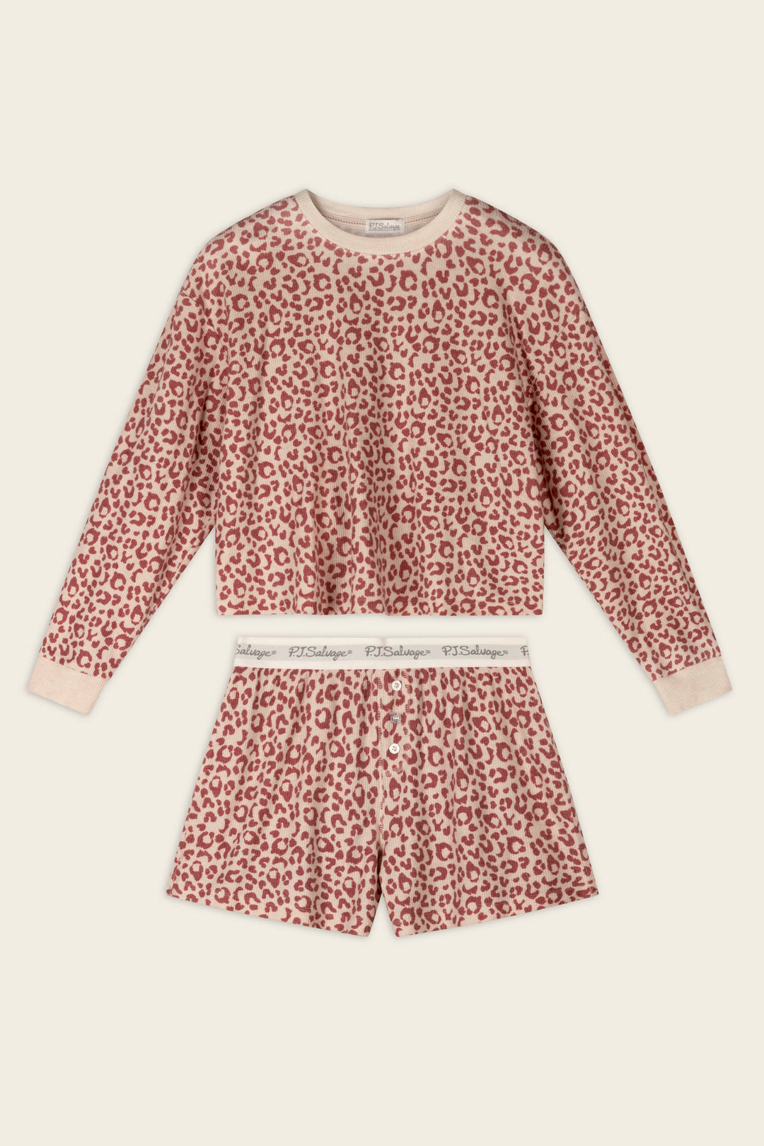 The Boyfriend Boxer Leopard Print Long Sleeve & Shorts PJ Set by P.J. Salvage features a pink and beige leopard print, with a long-sleeve top and matching shorts that have a white waistband with repeating text.