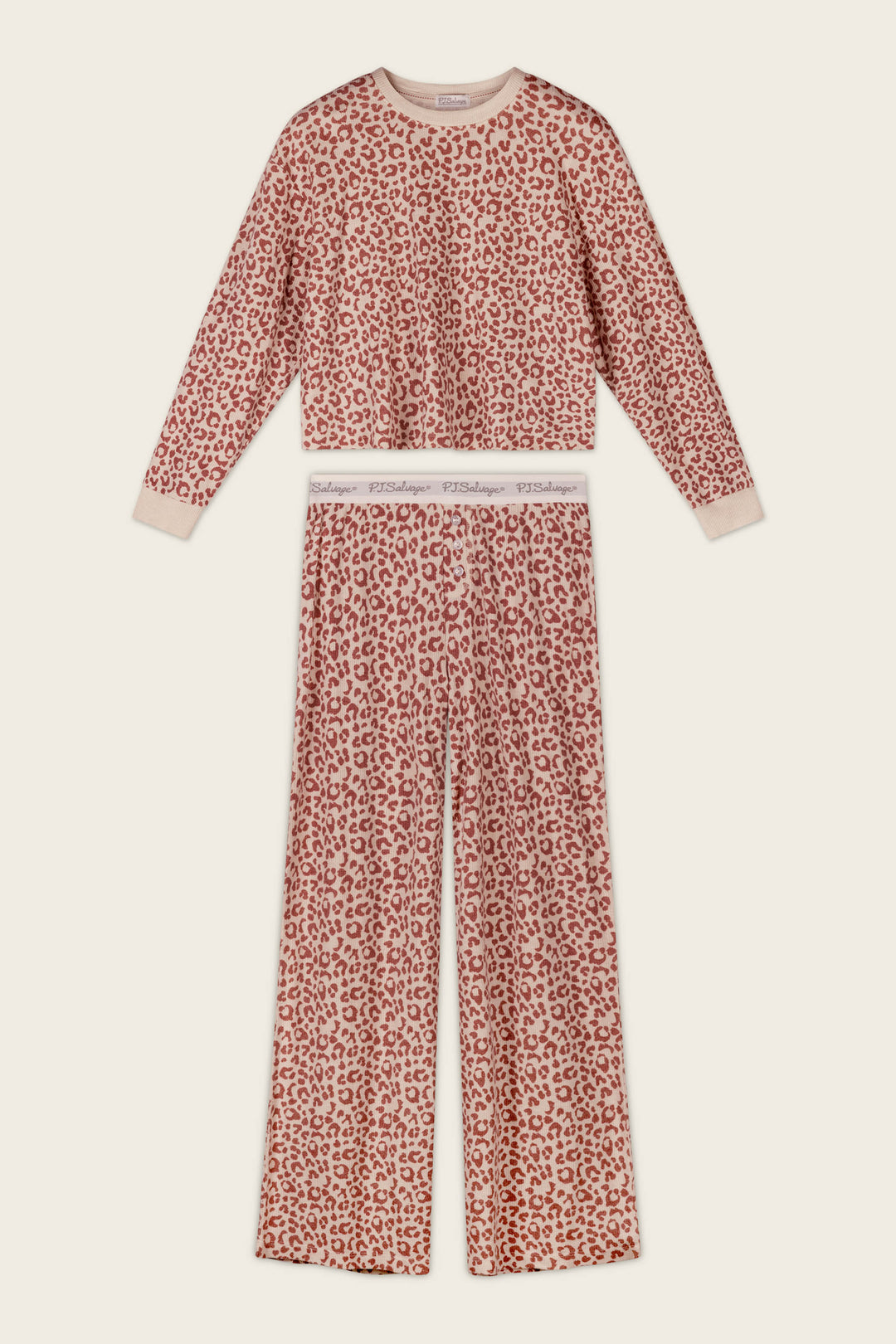 The P.J. Salvage Boyfriend Boxer Leopard Print Long Sleeve PJ Set features a pink and beige leopard print, including a long-sleeve top and coordinating wide-leg pants with a branded elastic waistband, displayed laid flat on a light background.