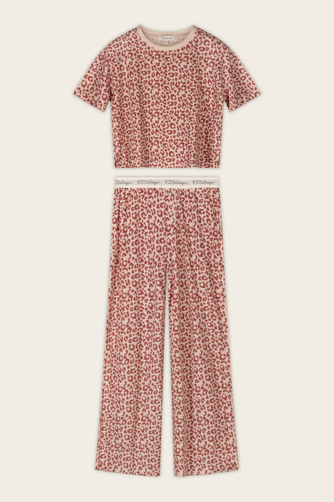 The P.J. Salvage Boyfriend Boxer Leopard Print Short Sleeve & Pants PJ Set features a bold red and white leopard print, with a short-sleeve cropped top and high-waisted, wide-leg pants finished with an elastic waistband.