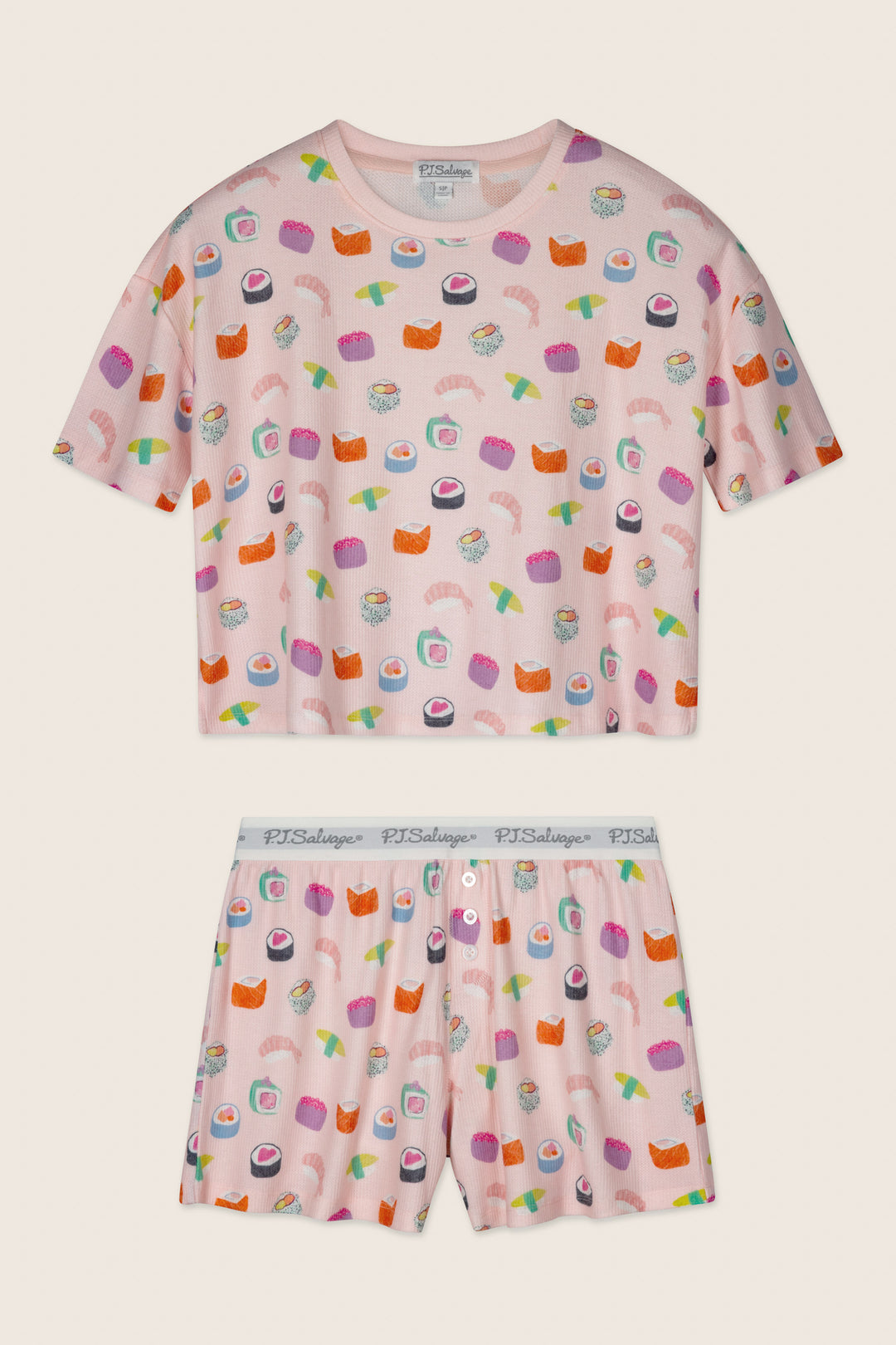 The Boyfriend Boxer Sushi Bites Short PJ Set by P.J. Salvage features a pink short-sleeve top and shorts with a colorful sushi print and a white elastic waistband displaying "PJ Salvage" in gray text.