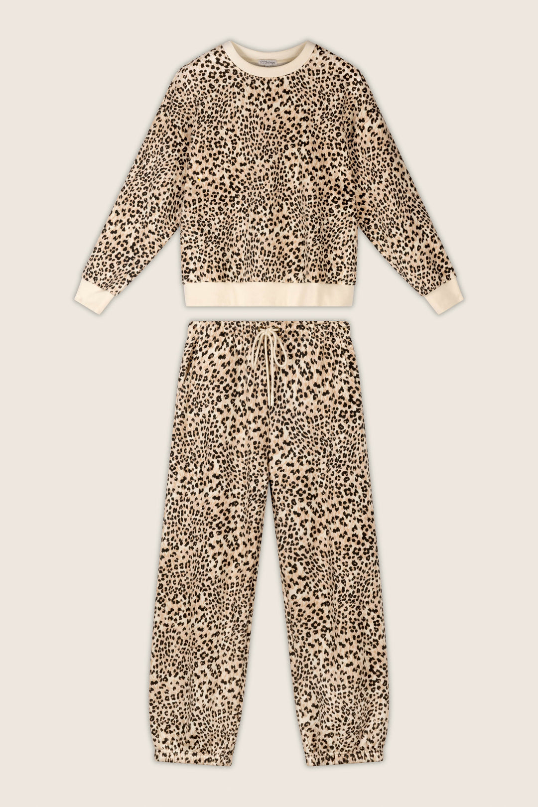 P.J. Salvage "C'est La Vie Leopard Print Frankie Sweater" two-piece lounge set, featuring a long-sleeve top and matching drawstring pants with a beige background and black leopard print, laid flat on a light surface.