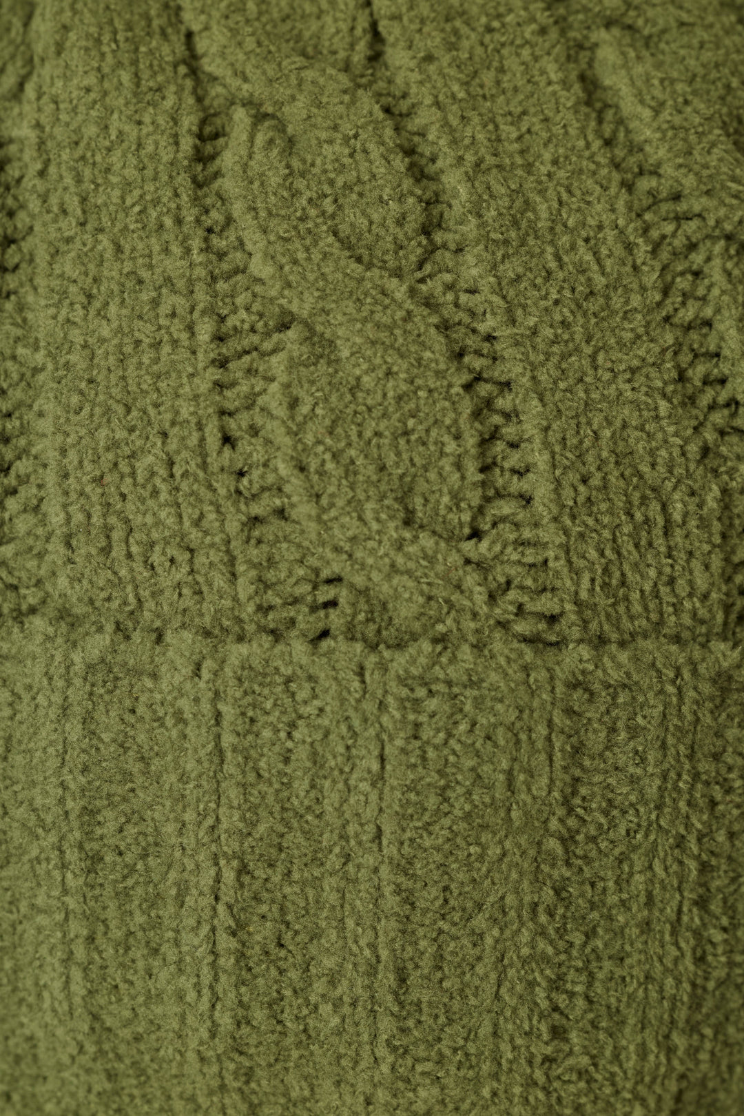 Close-up of the Cozy Chenille Cable Knit Olivine Beanie with Pompom by P.J. Salvage, showcasing its textured green cable knit pattern and vertical ribbing.